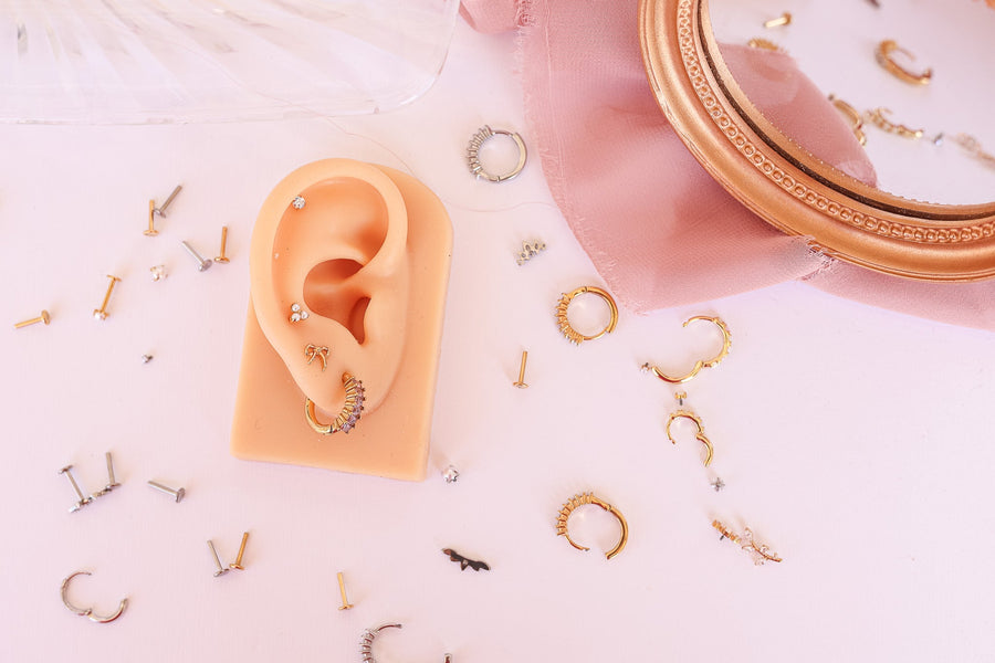 many gold and stainless steel micro earrings. Including flat back and ball back studs.