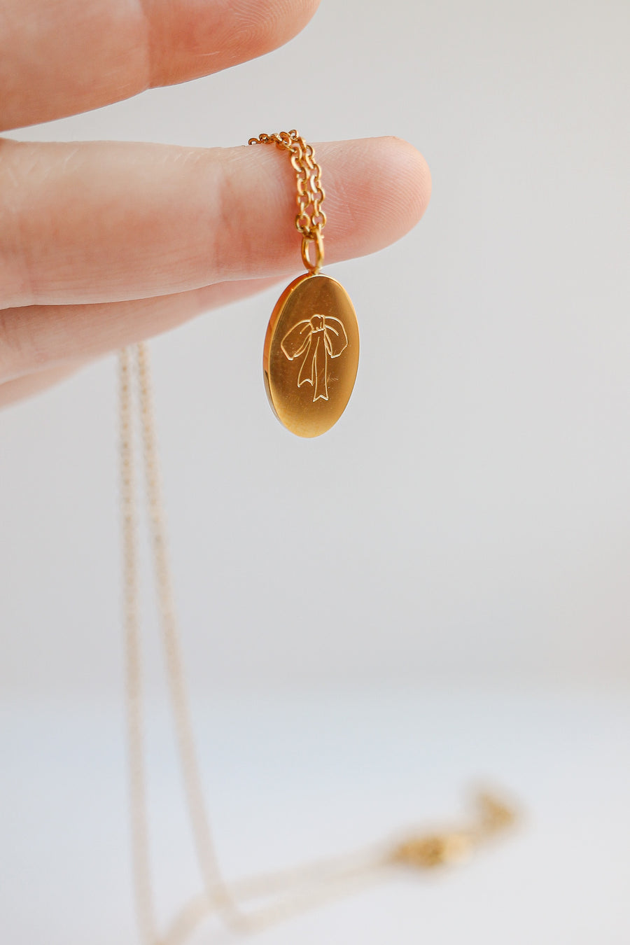 Bow Pendant Necklace in Gold